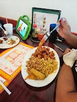 Orange Chicken with Fried Rice Chow Mein and Egg Roll